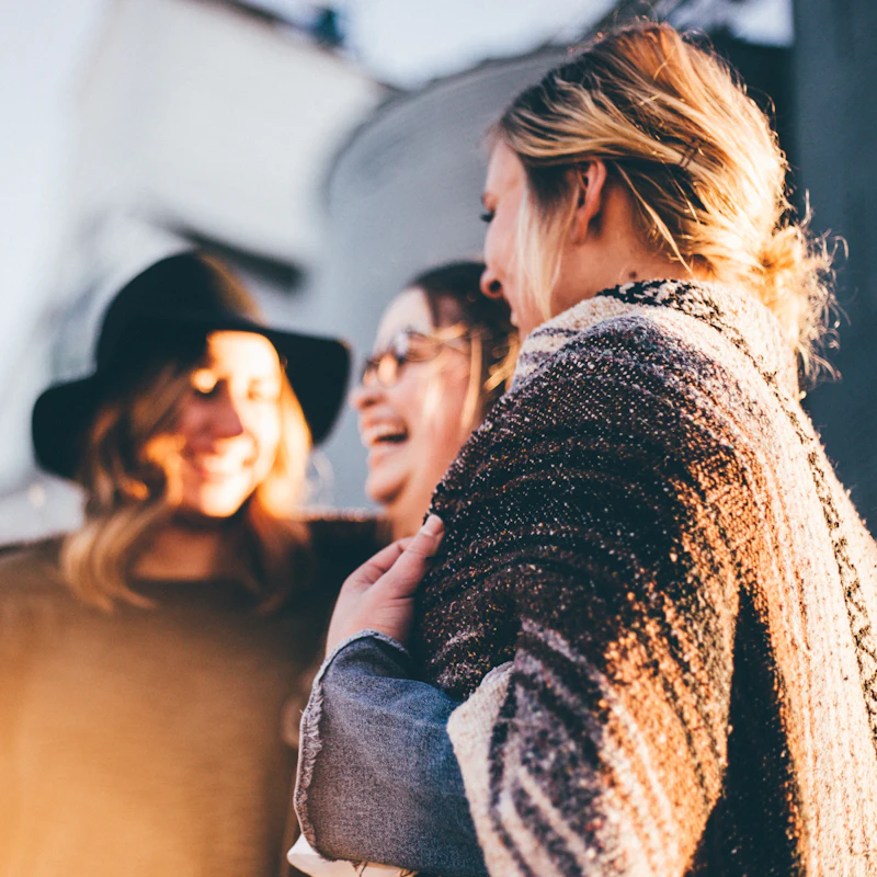 Members laughing together outside after church